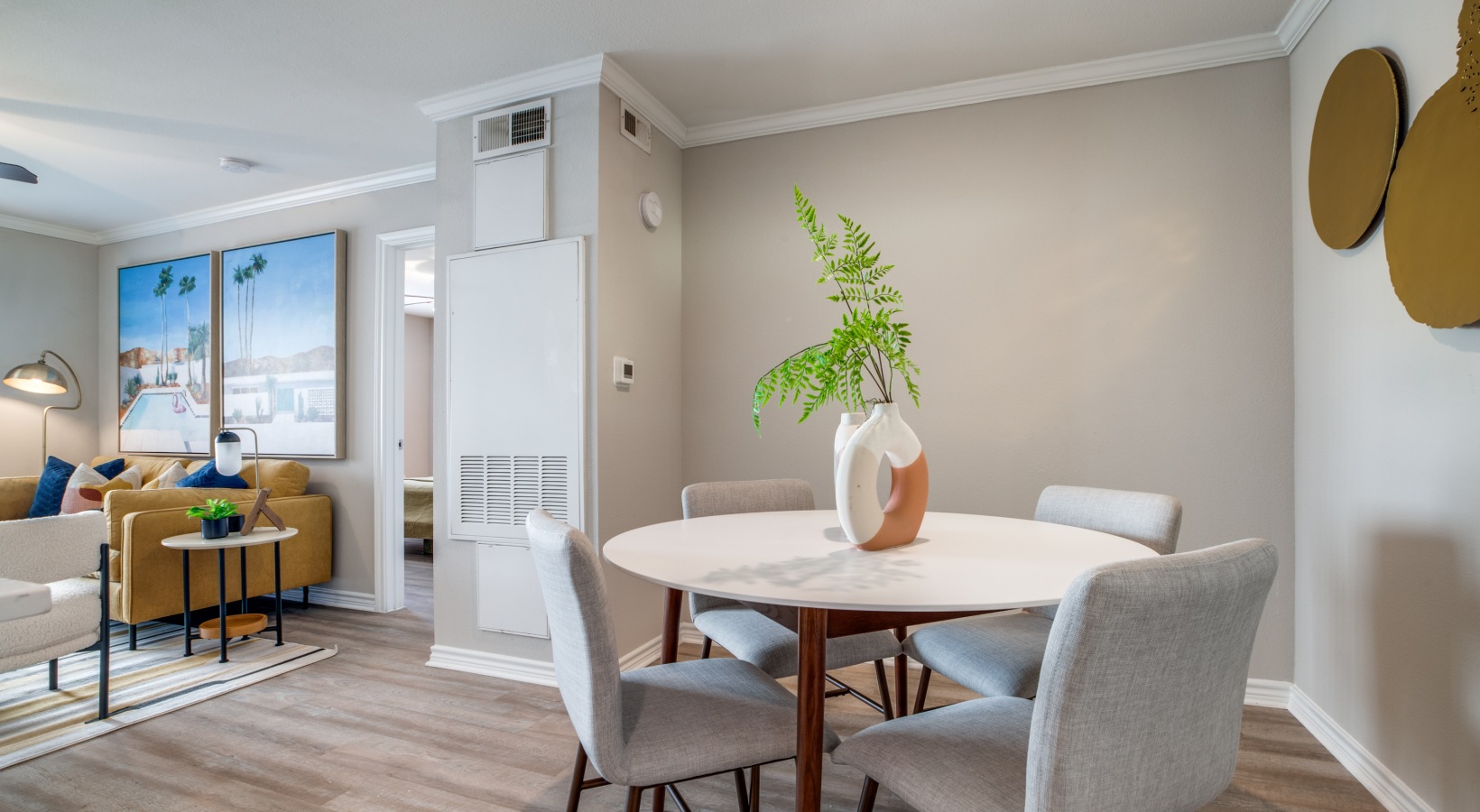a dining room and living room with a table and chairs at The Argyle