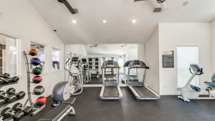 a gym room with treadmills and exercise equipment at The  Argyle